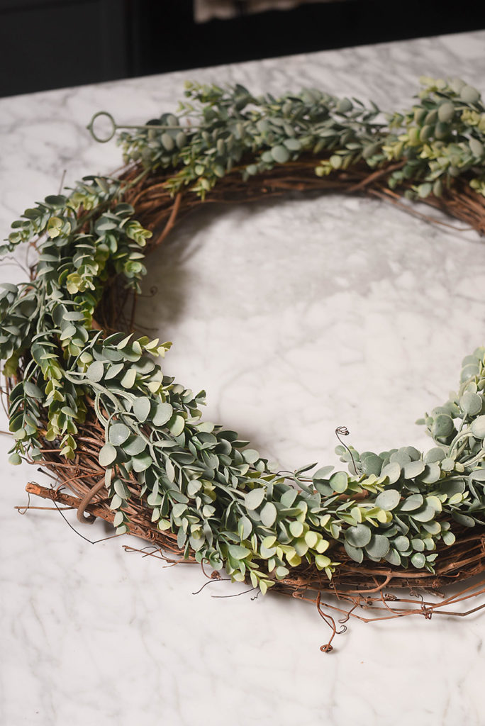 Lay out greenery garland - DIY Farmhouse Style Wreath - Our Handcrafted Life